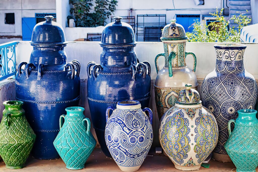 A variety of handmade ceramic vases in vibrant colors and intricate patterns.